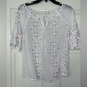 White blouse ruffled sleeves with colored eyelet design